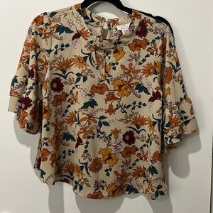 Urban Romantics floral top with bell bottom sleeves